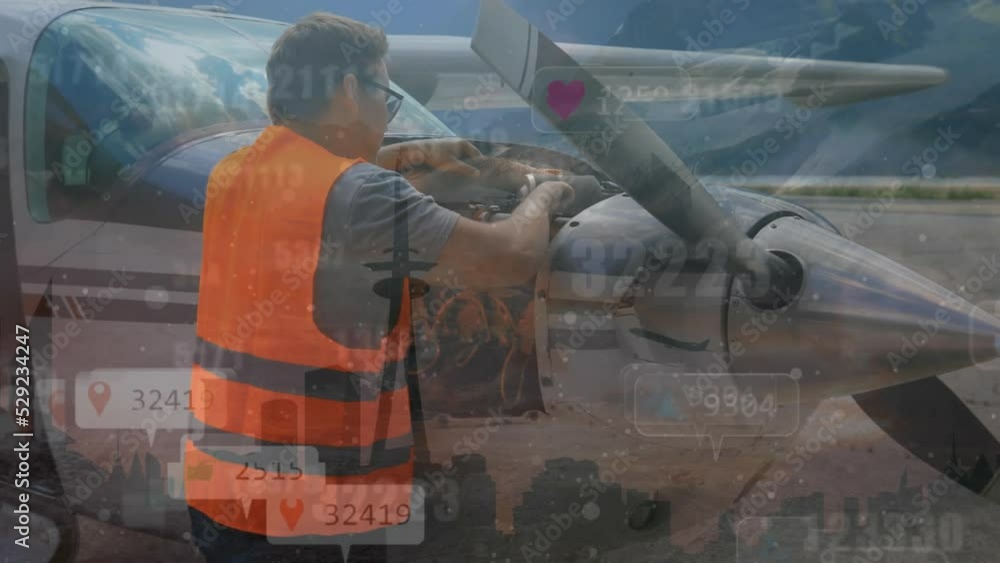 Animation of caucasian engineer fixing airplane over social media icons Animation of caucasian engineer fixing airplane over social media icons