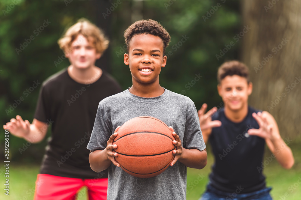 great child Team in sportswear playing basketball game