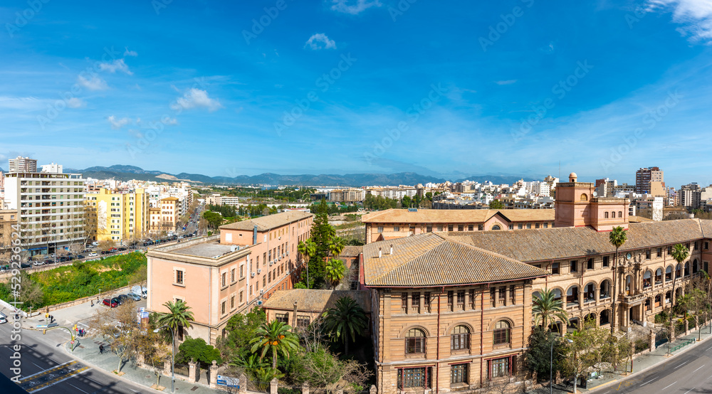 High view of the Sky line of Palma de Mallorca with mountain views, blue sky	