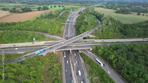 Aerial View of British Motorways With Fast Moving Traffic at Peak Time. M1 J11 and  J7 Motorways Junction Interchange. Time Lapse Shot captured on 7th Sep 2022 photo