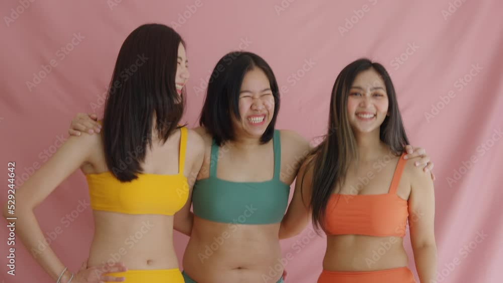 Diverse group of asia people lady show self love smile look at camera dance in studio model photo shooting. Happy proud of woman power plus size chubby fat posing and slim skinny figure type shape. Diverse group of asia people lady show self love smile look at camera dance in studio model photo shooting. Happy proud of woman power plus size chubby fat posing and slim skinny figure type shape.