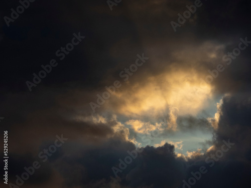 Impressive cloud view with ray of sunlight at sunset time.