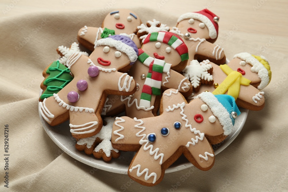 Delicious Christmas cookies on beige napkin, closeup view