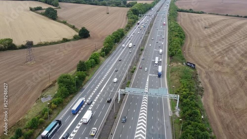 Aerial View of British Motorways With Fast Moving Traffic at Peak Time. M1 J11 and  J7 Motorways Junction Interchange. Time Lapse Shot captured on 7th Sep 2022 photo