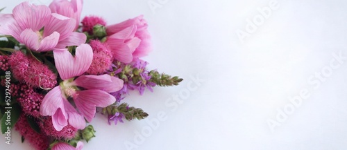 Fototapeta Naklejka Na Ścianę i Meble -  Bouquet of pink flowers on a white background. Festive flower arrangement. Background for a greeting card.