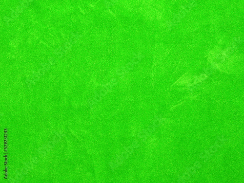 green velvet fabric texture used as background. Empty green fabric background of soft and smooth textile material. There is space for text...