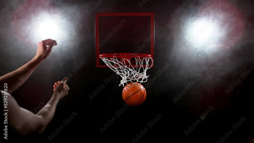 Super slow motion of basketball player hitting the basket. Filmed on high speed cinema camera Phantom, 1000fps. Speed ramp effect. Super slow motion of basketball player hitting the basket. Filmed on high speed cinema camera Phantom, 1000fps. Speed ramp effect.
