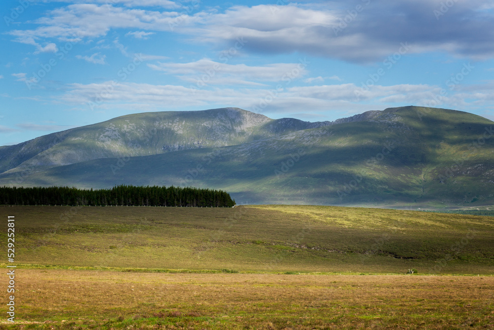 Rolling hills and mountains in north west Ireland. In the background the mountains of Wild Nephin National Park.
