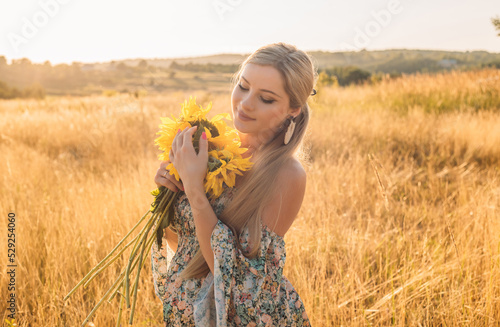 portrait of beautiful happy pregnant woman in countryside during sunset