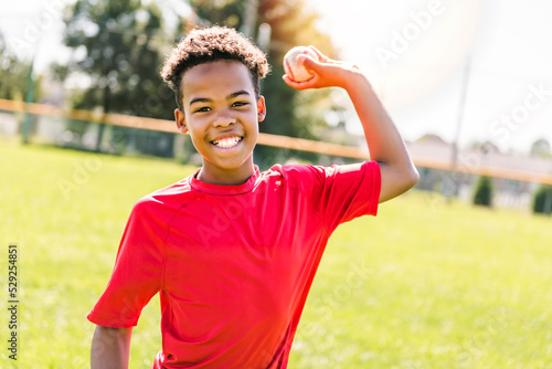 Canvas Print portrait of child with glove and looking at camera playing baseball