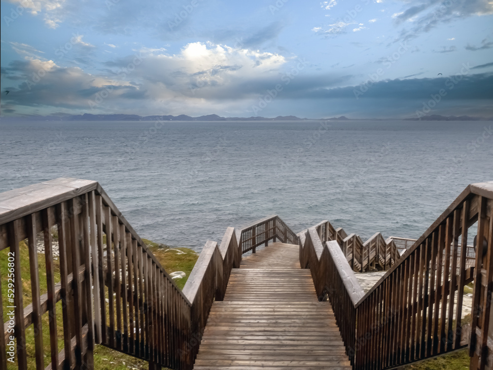 Fototapeta premium Beautiful coastal boardwalk in Nuuk (Godthåb, the capital and largest city of Greenland. The seat of government and the country's largest cultural and economic centre.