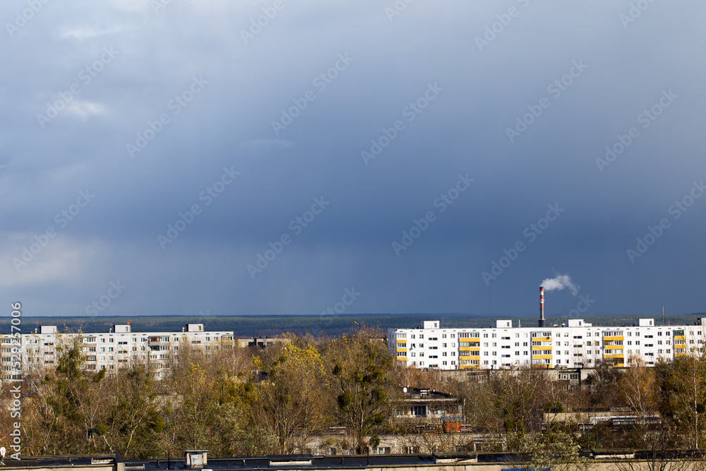 Industrial cityscape, residential area and power plant