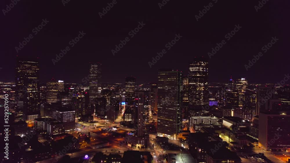Aerial view of downtown Denver at night. Buildings of Denver from top view. Business center of Denver on evening time. Aerial view of downtown Denver at night. Buildings of Denver from top view. Business center of Denver on evening time.