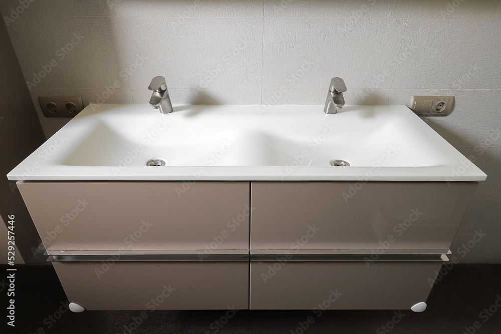 Fototapeta premium Double washbasin with two taps in the bathroom
