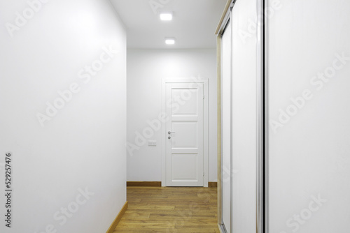 White interior doors in the white corridor