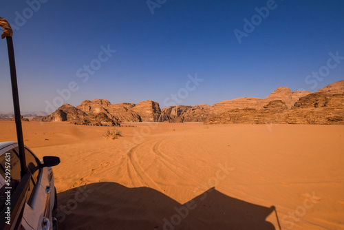 Tourist in Wadi Rum Desert in an offroad car. Travel and tourism concept. Adventure trip.