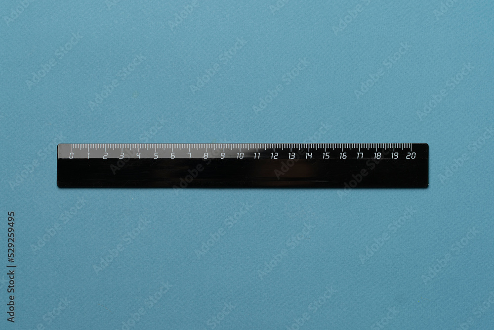 twenty centimeters black ruler isolated on pastel background