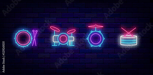 Drum and drumsticks neon signs collection. Drum school logotypes pack. Musical instrument. Vector stock illustration