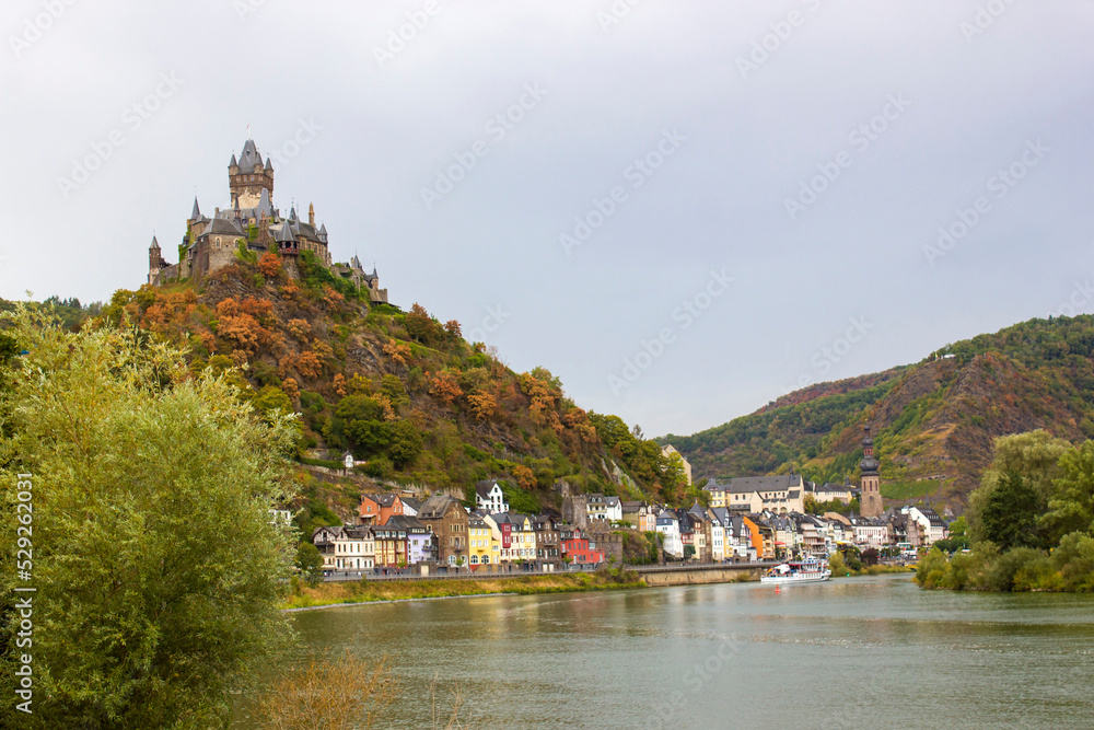 Cochem in Germany -  city view with Reichsburg castle on a hill in autumn color