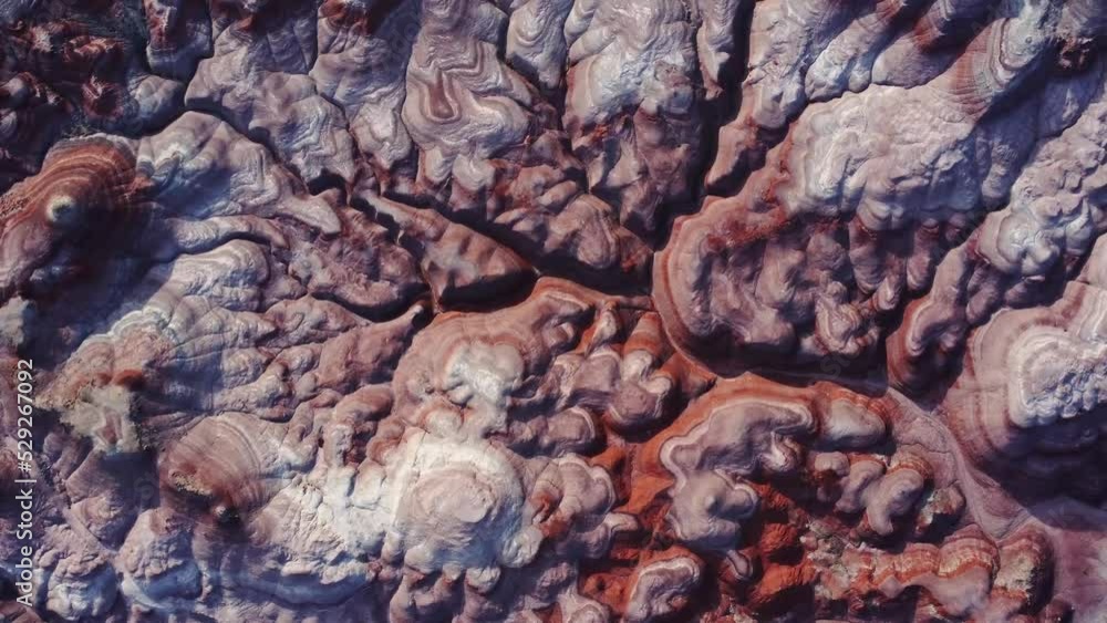 Textured background of uneven surface of sandstone cliffs in sunlight Textured background of uneven surface of sandstone cliffs in sunlight