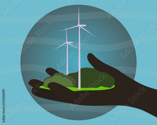 wind turbine in hand on the blue background 