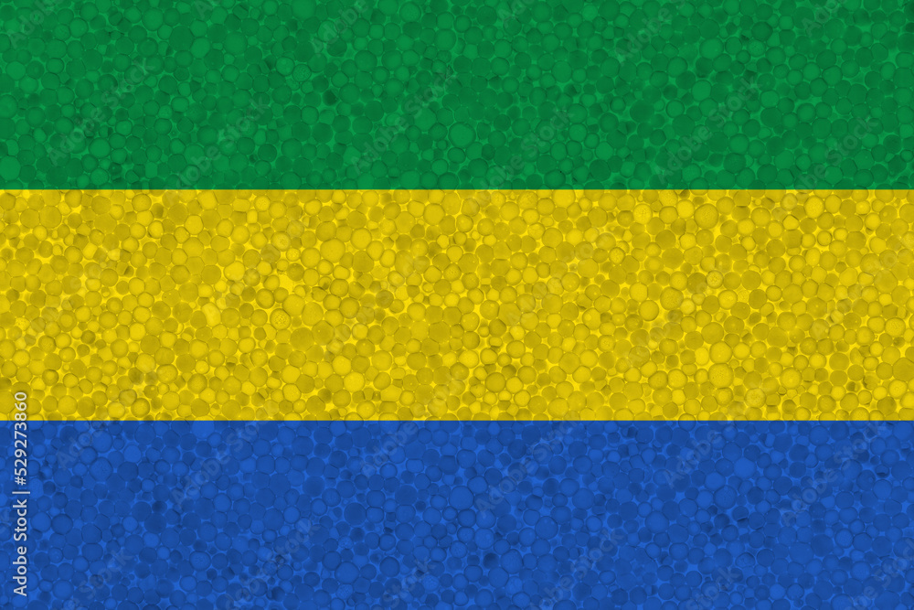 Flag of Gabon on styrofoam texture. national flag painted on the surface of plastic foam Flag of Gabon on styrofoam texture. national flag painted on the surface of plastic foam