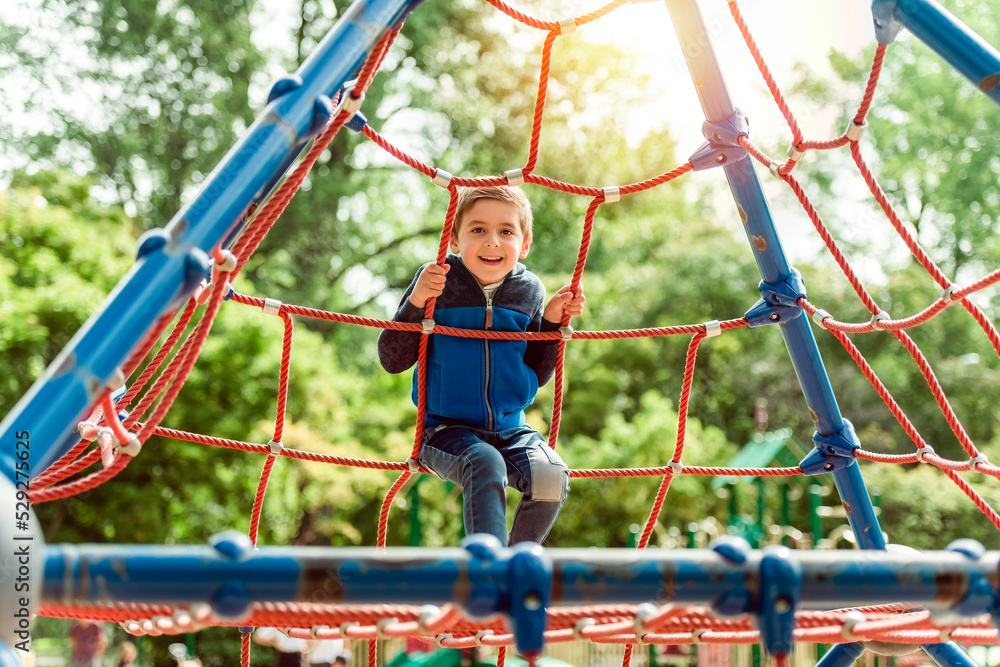 cute boy having fun on a playground cute boy having fun on a playground