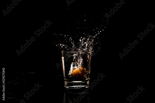 High resolution natural water splash freeze motion from a clean glass of water with droplet and bubble formation