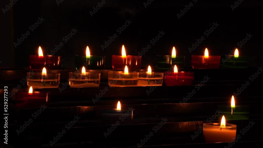 Burning candles in a dark church Burning candles in a dark church