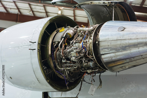 Low angle view of jet engine at airplane hanger photo