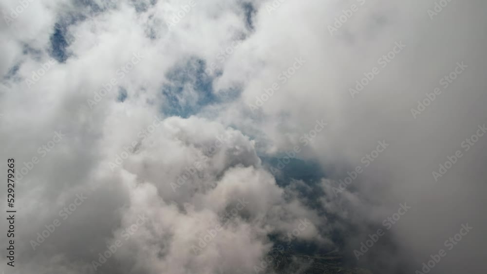 Moving white clouds blue sky smoothly scenic aerial view. Drone flies forward high in blue sky through fluffy clouds on panorama sky. Fog. Nature Moving white clouds blue sky smoothly scenic aerial view. Drone flies forward high in blue sky through fluffy clouds on panorama sky. Fog. Nature