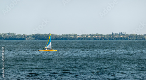 A sailboat sailing on a large lake