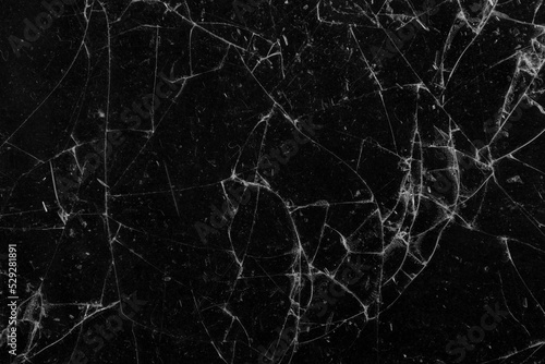 Broken smartphone glass as a background. © Yevhenii