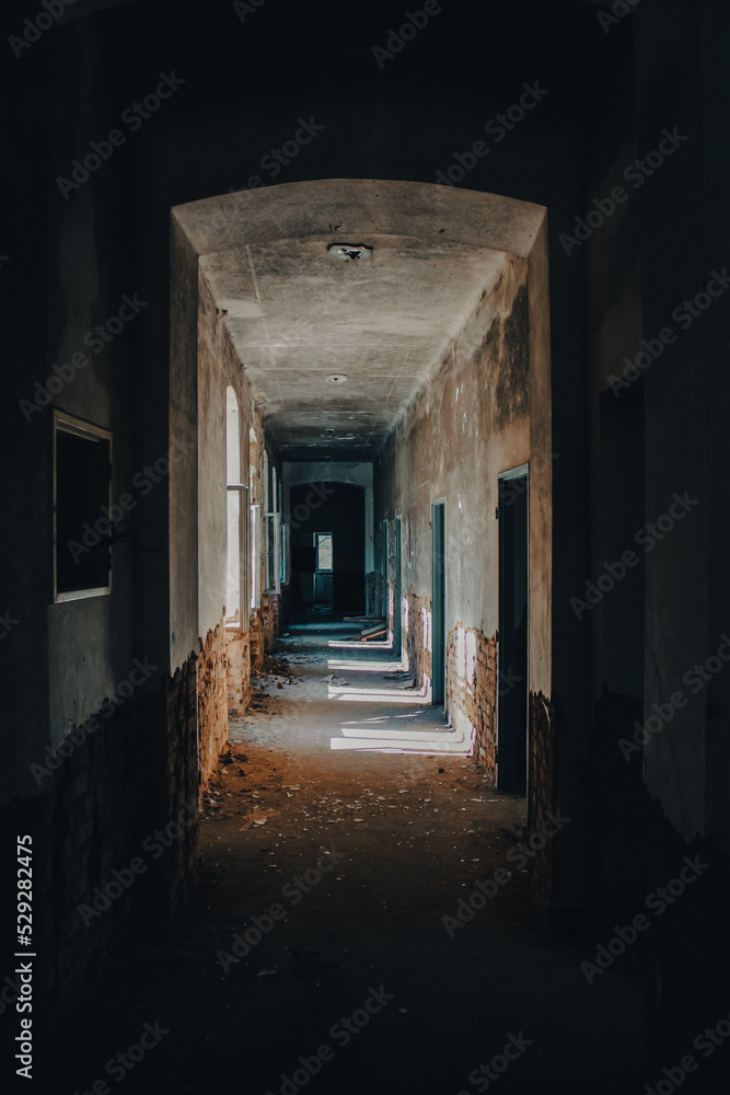 hallway in old abandoned building, sunlight, play of light and shadows