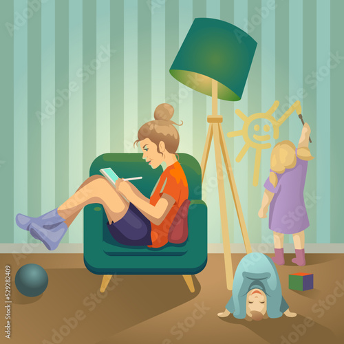 Mom draws on a tablet in a chair (ID: 529282409)
