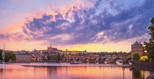 City summer landscape at sunset  panorama  banner - view of the Charles Bridge and castle complex Prague Castle in the historical center of Prague  Czech Republic