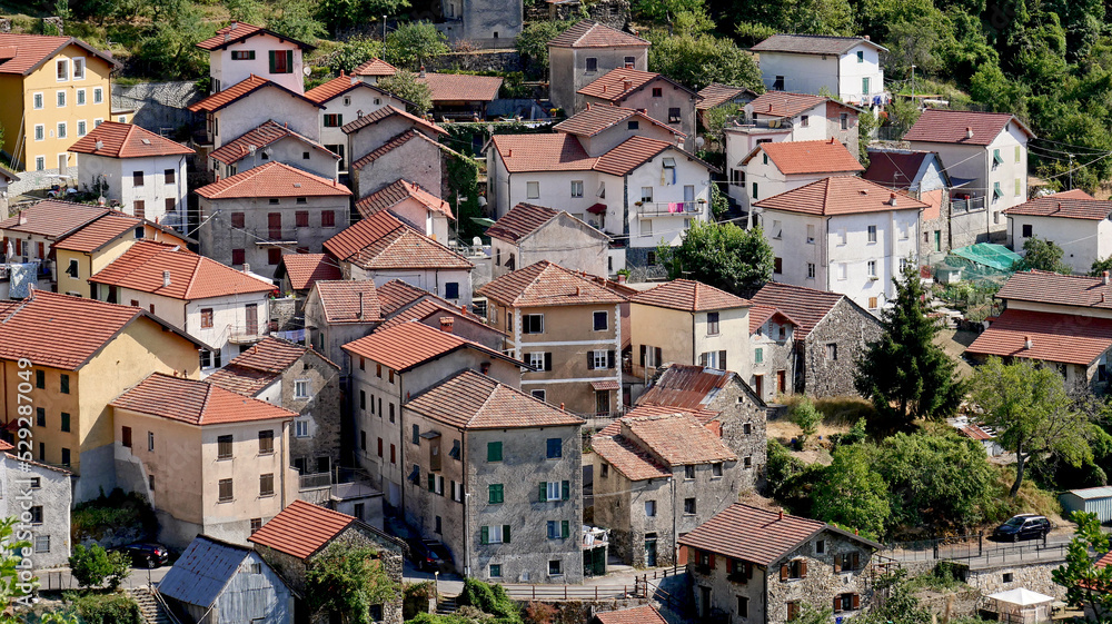 Group of rural and residential houses in a village in the Ligurian hinterland, in Italy.
