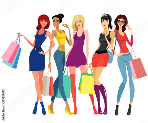 Young female models standing and colorful shopping bags in their hands.