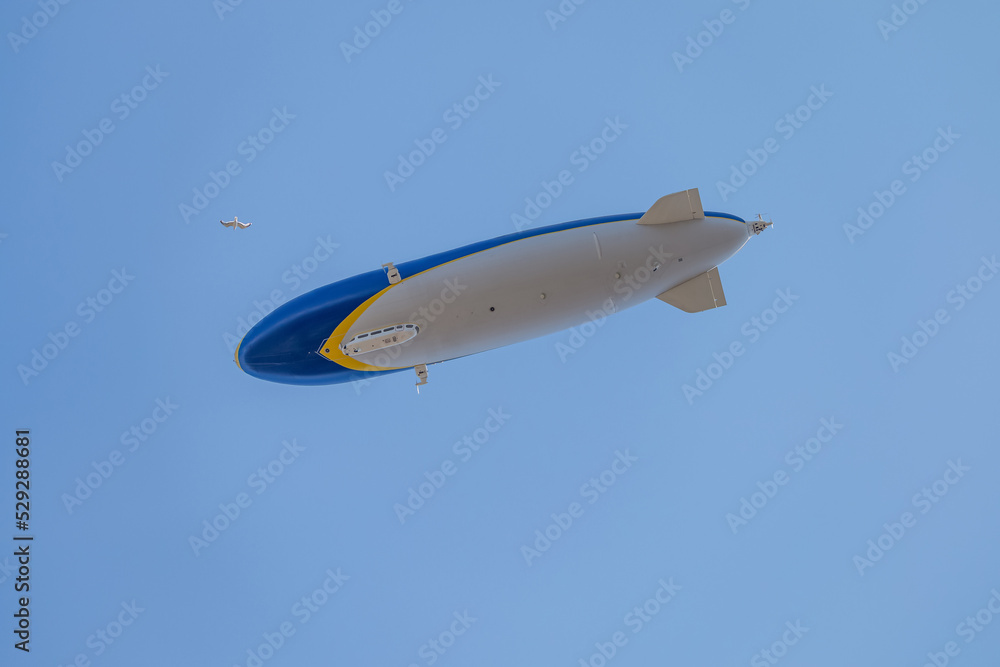 Zeppelin flying over the sky - In summer sky - Denmark Zeppelin flying over the sky - In summer sky - Denmark