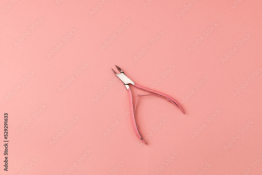 Tweezers for hands, pink on pink background - monochrome Tweezers for hands, pink on pink background - monochrome