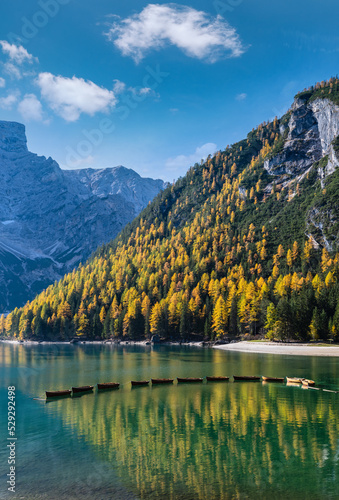 Fototapeta Naklejka Na Ścianę i Meble -  Autumn peaceful alpine lake Braies or Pragser Wildsee. Fanes-Sennes-Prags national park, South Tyrol, Dolomites Alps, Italy, Europe. Picturesque traveling, seasonal and nature beauty concept scene.