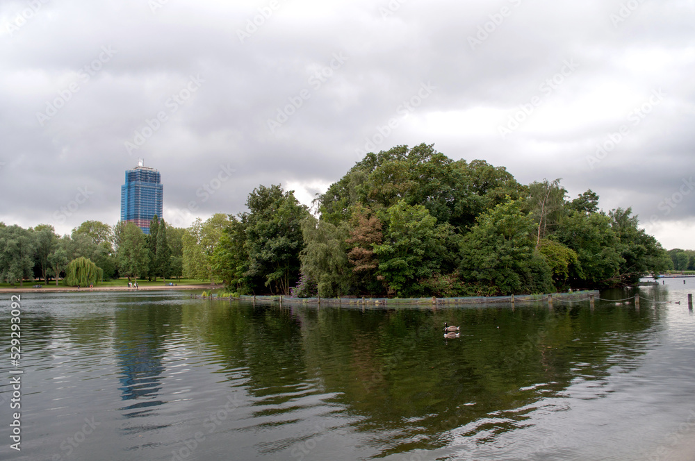 Lake with an island and a skyscraper in London's Hyde Park Lake with an island and a skyscraper in London's Hyde Park