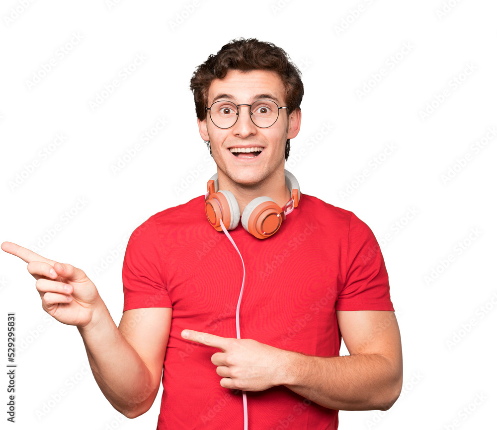 Surprised young man using a smartphone and pointing with his finger Surprised young man using a smartphone and pointing with his finger