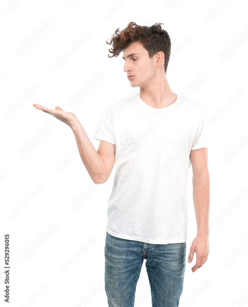 Confident young guy showing something with his hand Confident young guy showing something with his hand