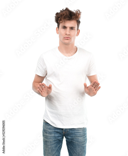 Confident young guy doing a keep calm gesture