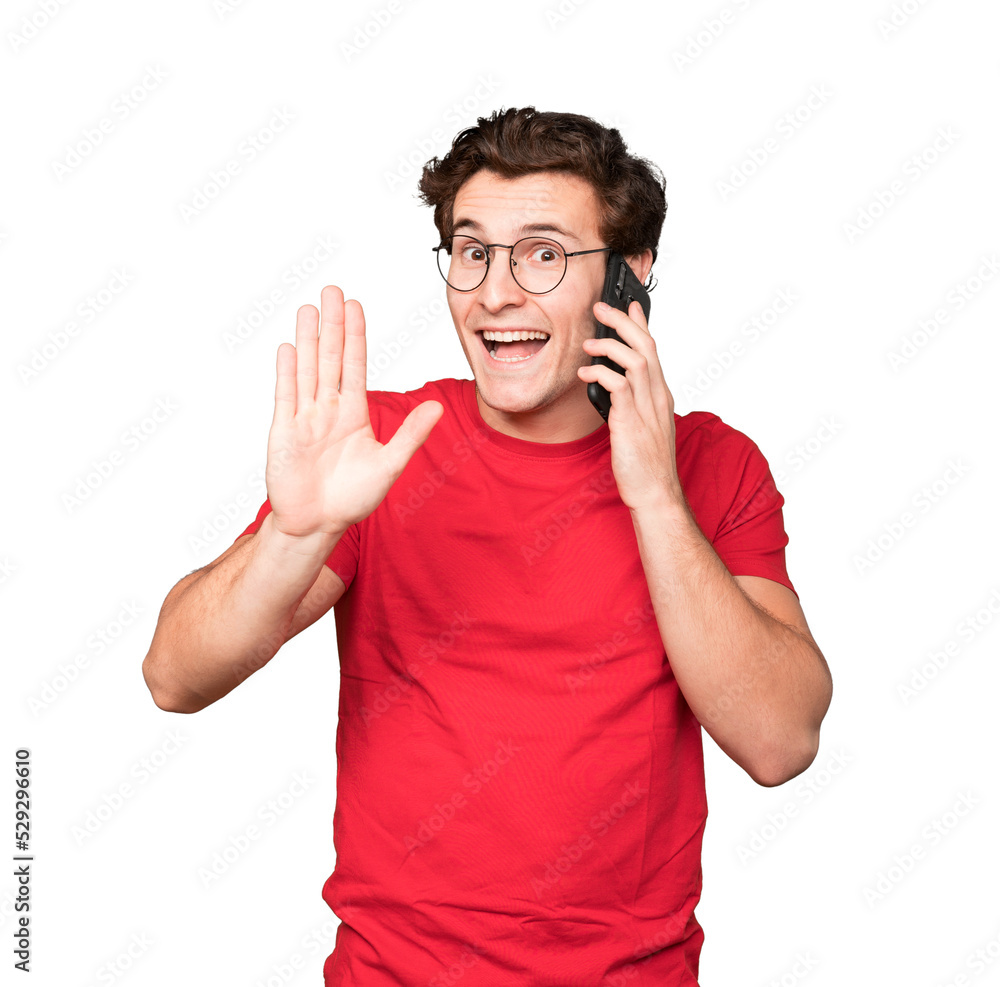 Fototapeta premium Happy young man using his mobile phone