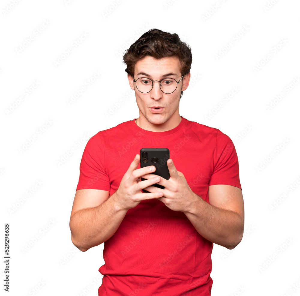 Surprised young man using his mobile phone Surprised young man using his mobile phone