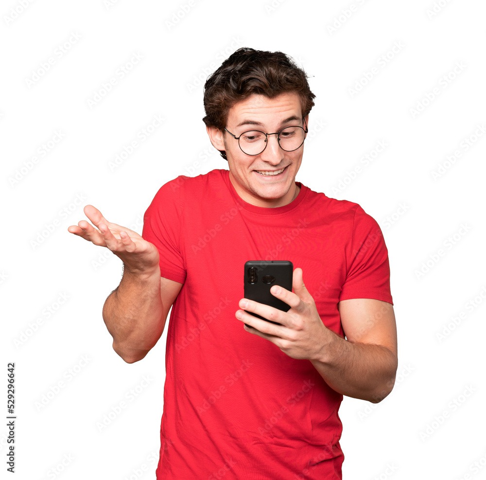 Surprised young man using his mobile phone Surprised young man using his mobile phone