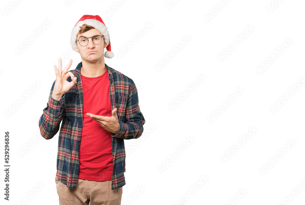 Young man at Christmas doing gestures Young man at Christmas doing gestures