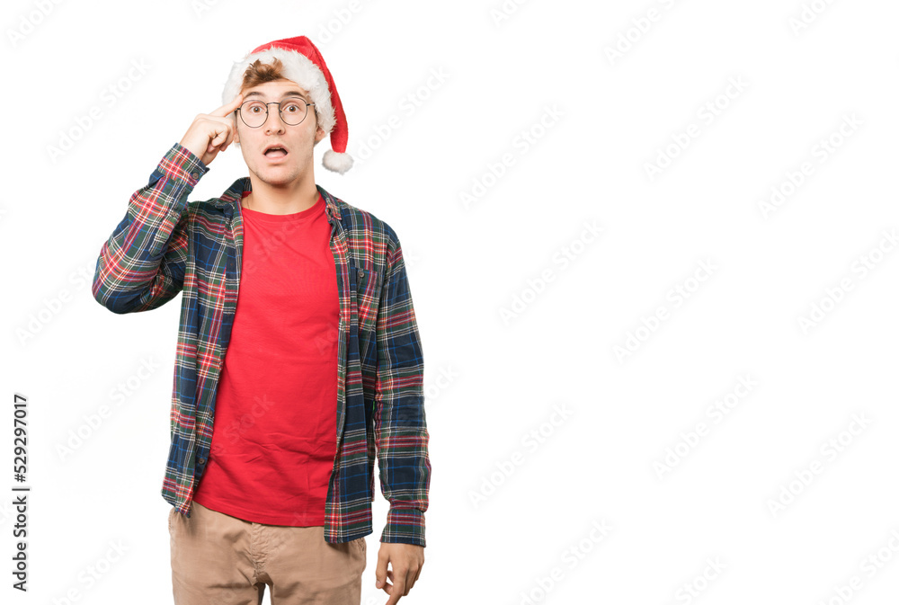 Young man at Christmas doing gestures Young man at Christmas doing gestures
